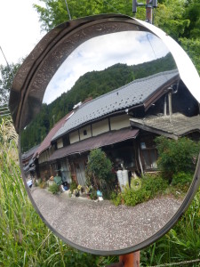Cool shot in a street view mirror.  (My mother would be proud of this artsy shot.)