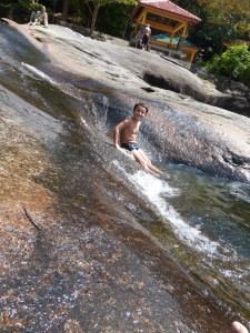 Sliding down into the waterfall.