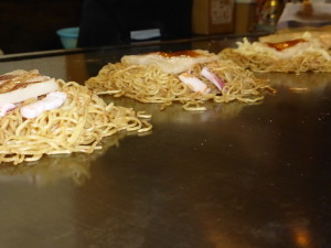Cooking okonomiyaki with squid