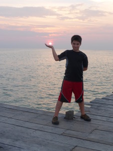 Holding the sun in his hands